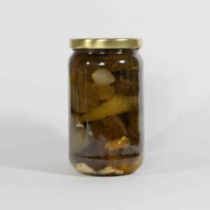 A jar of pickled cucumbers and garlic cloves.